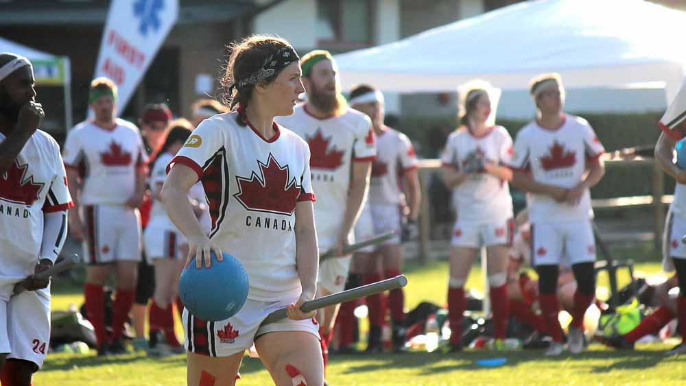 Female quidditch player wearing the 2018 Quidditch Canada light kit.